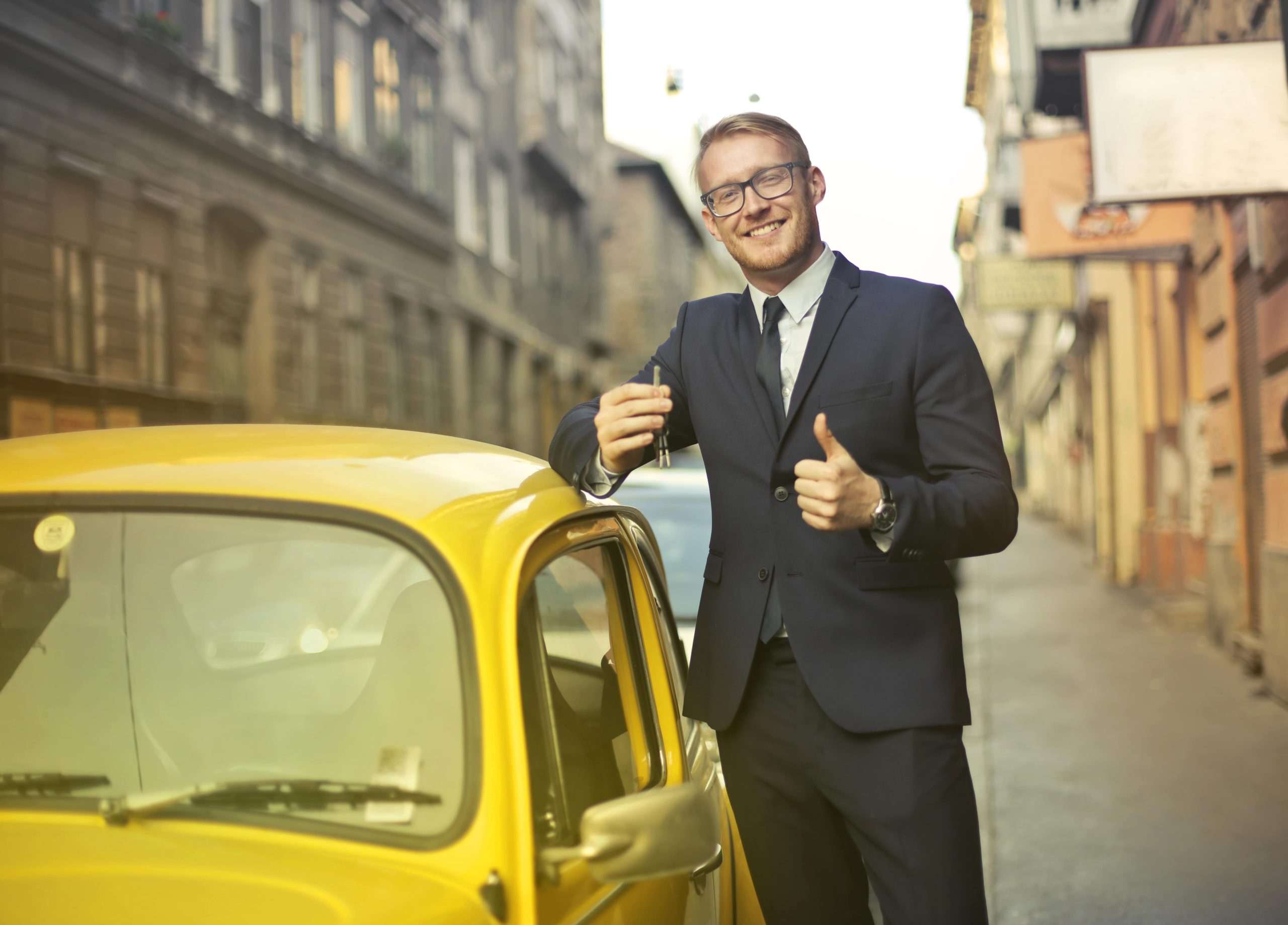 businessman-with-cute-car-min